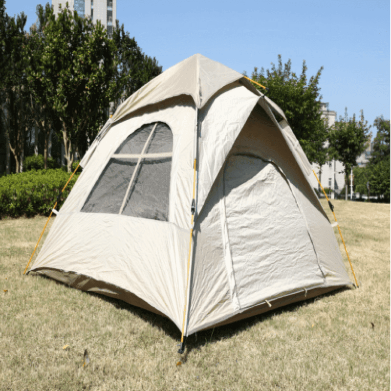 Upgraded variant beige tent with two doors and two windows pitched on green grass, showcasing premium cross-ventilation mesh panels.
