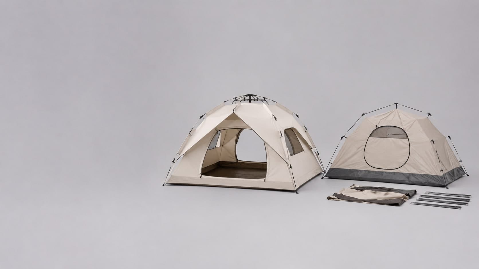 An automatic hydraulic-frame camping tent beside a manual pole-assembly tent for comparison