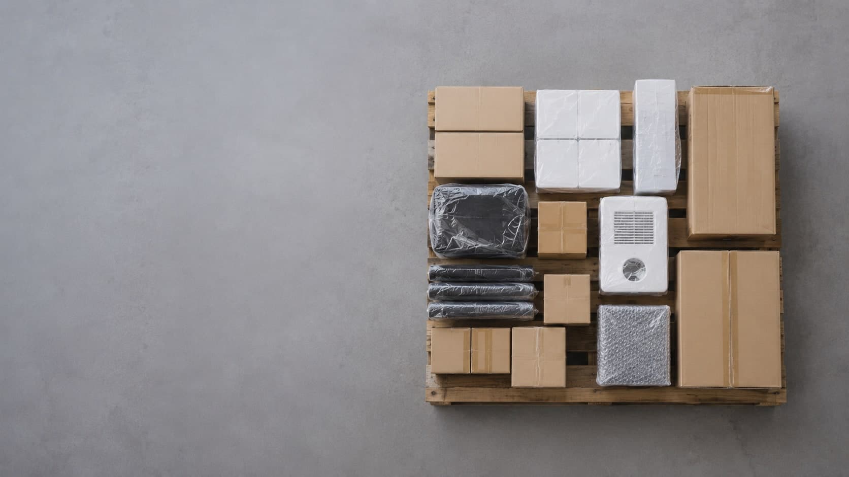 A small consolidated batch of mixed products packed for a low-MOQ container shipment from China