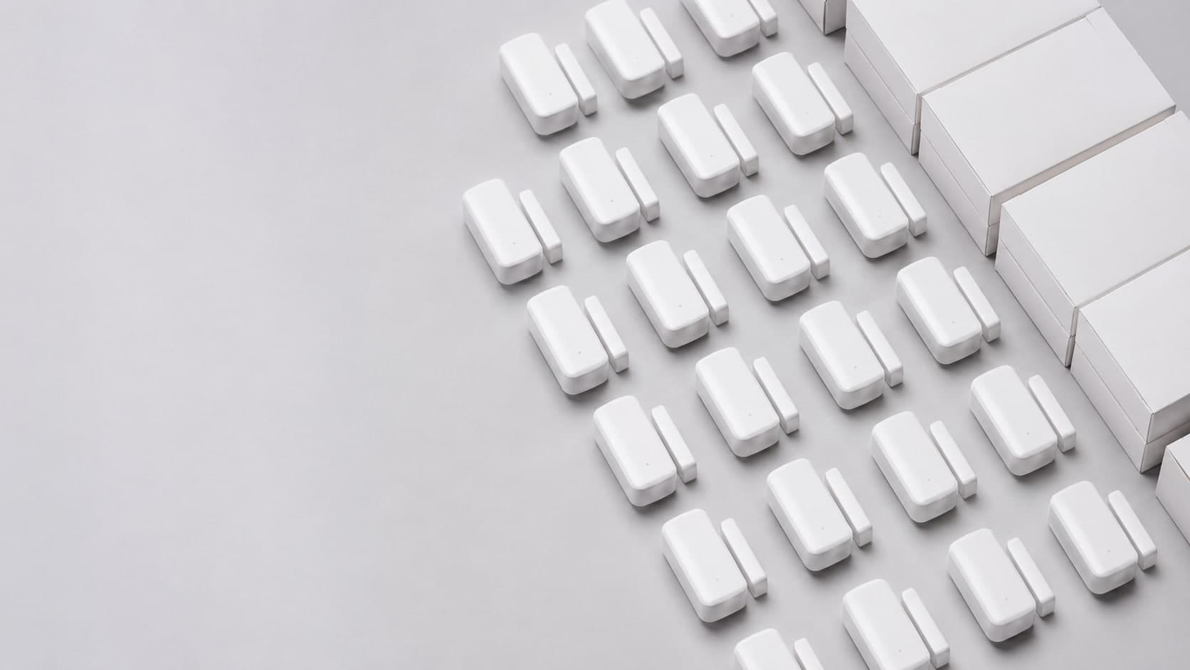 Wholesale smart door and window contact sensors arranged in bulk with retail packaging