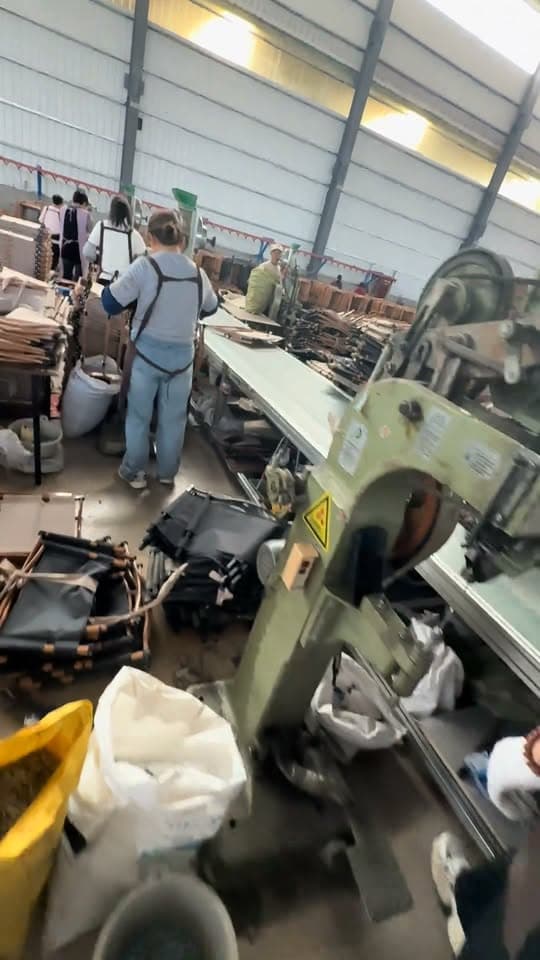 Camping-chair components and workers in the chair-production workshop shown in Seawing's Facebook Reel