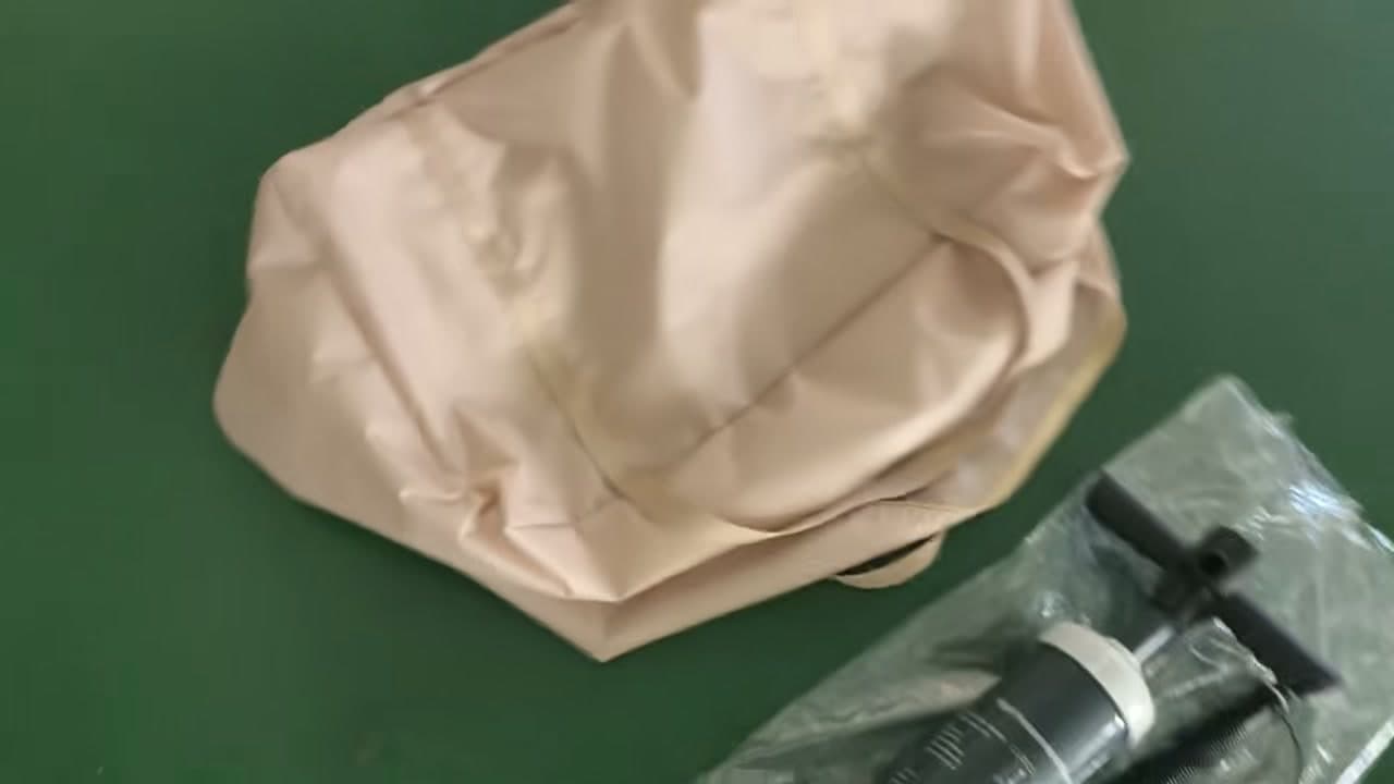Light-coloured textile panel on an indoor work surface in the Facebook video